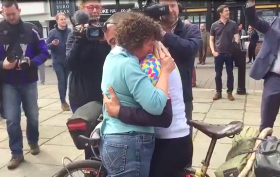 Leigh Timmis and his mom embrace after Timmis' adventure finally ends.