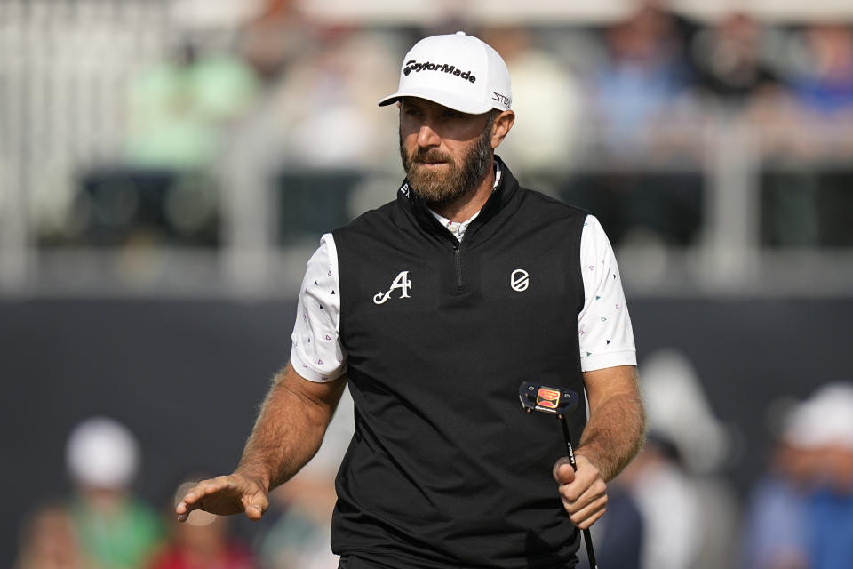 Dustin Johnson waves after his putt on the sixth hole during the first round of the PGA Championship golf tournament at Oak Hill Country Club on Thursday, May 18, 2023, in Pittsford, N.Y. (AP Photo/Eric Gay)