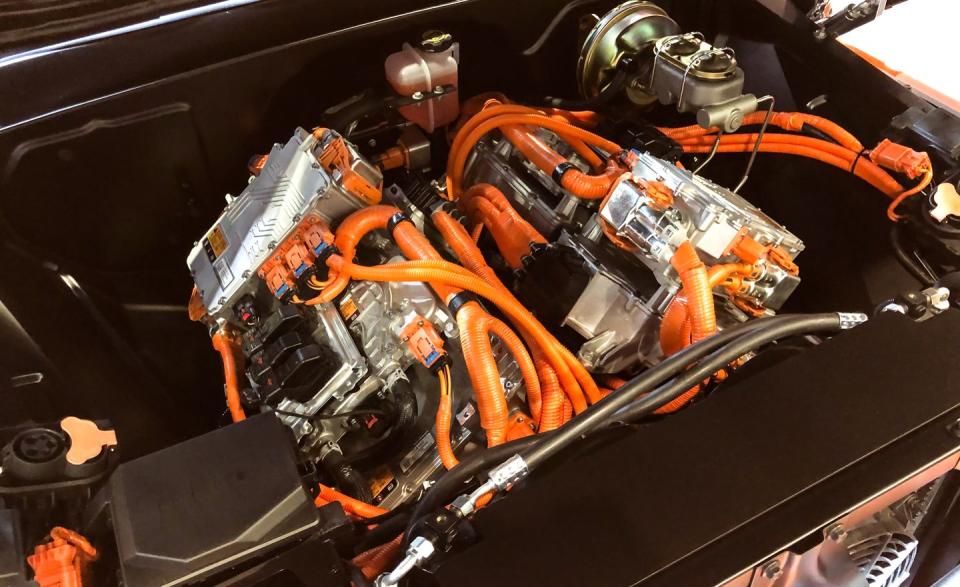 <p>It's not an engine, it's a motor. The <a href="https://www.caranddriver.com/news/a29714391/chevy-e-10-pickup-sema/" rel="nofollow noopener" target="_blank" data-ylk="slk:Chevrolet E-10 concept;elm:context_link;itc:0;sec:content-canvas" class="link ">Chevrolet E-10 concept</a> is a 450-hp electrified C-10 pickup. Typically the only time a 1970s Chevy pickup is plugged into anything, it's connected to a trickle charger. The E-10 has its batteries in the bed. The two electric motors seen here are called eCrate motors, a nod to the popular Chevy crate engines that <a href="https://www.caranddriver.com/reviews/a15097317/flyin-miata-habu-mx-5-v-8-test-review/" rel="nofollow noopener" target="_blank" data-ylk="slk:can be found swapped into just about anything;elm:context_link;itc:0;sec:content-canvas" class="link ">can be found swapped into just about anything</a>. GM claims the E-10 can complete a zero-to-60-mph run in about five seconds with a quarter-mile time in the high 13s. A Tesla P100D might be quicker, but it doesn't look as cool. </p>