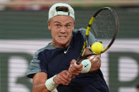 Denmark's Holger Rune plays a shot against France's Hugo Gaston during their third round match at the French Open tennis tournament in Roland Garros stadium in Paris, France, Saturday, May 28, 2022. (AP Photo/Michel Euler)