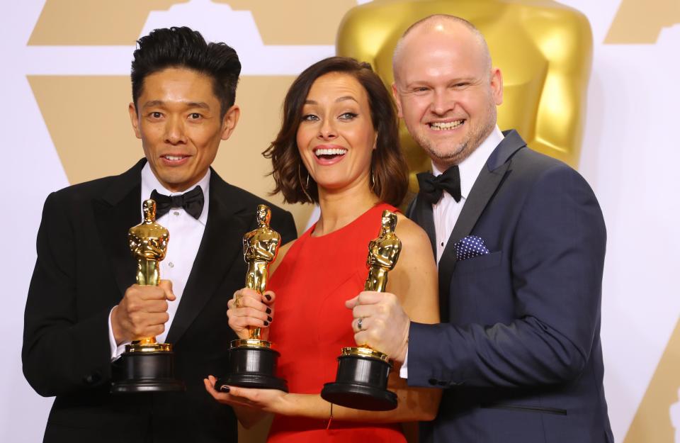 90th Academy Awards – Oscars Backstage – Hollywood, California, U.S., 04/03/2018 – Kazuhiro Tsuji, Lucy Sibbick and David Malinowski with their award for Best Makeup and Hairstyling for the film “Darkest Hour” REUTERS/Mike Blake