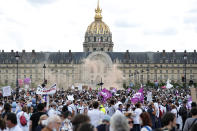 Hospital workers march during a demonstration, Tuesday, June 16, 2020 in Paris. French hospital workers and others are protesting in cities around the country to demand better pay and more investment in France's public hospital system, which is considered among the world's best but struggled to handle a flux of virus patients after years of cost cuts. France has seen nearly 30,000 virus deaths. (AP Photo/Thibault Camus)