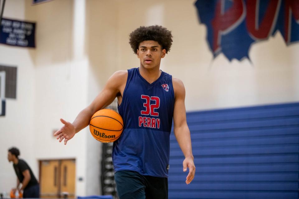 Perry Pumas Koa Peat walks with the ball during basketball practice at Perry High Perry School on Nov. 7, 2023.