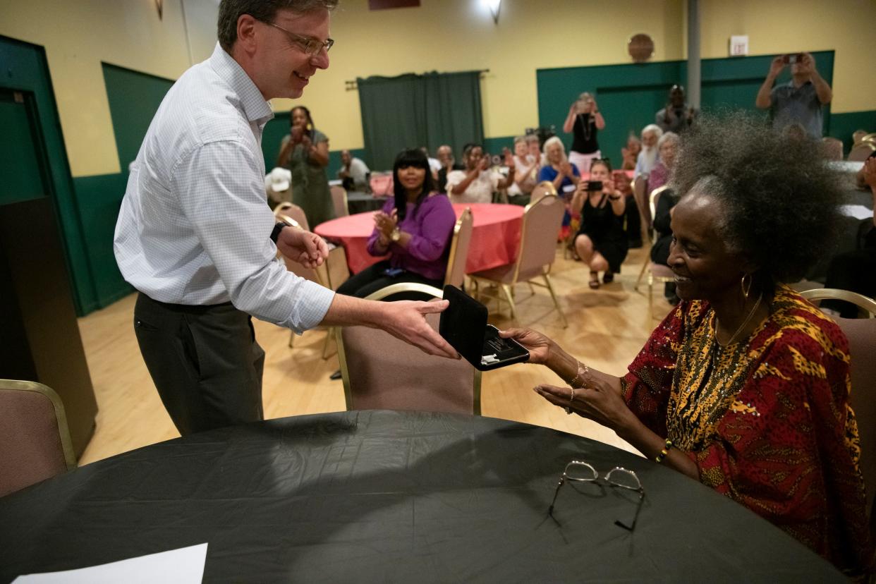Mayor James Mueller presents the Key to the City of South Bend to Debra Stanley at the Charles Martin Youth Center in South Bend on Friday, Aug. 11, 2023.