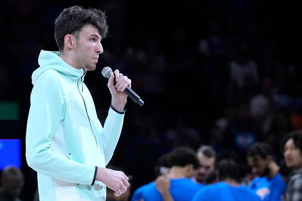 Injured Thunder rookie Chet Holmgren, the No. 2 overall pick in last year's NBA Draft, addresses the crowd before Sunday's game.