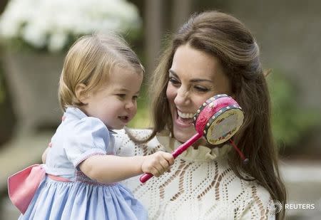 The Duchess of Cambridge holds Princess Charlotte during a children's party in Victoria, British Columbia, Canada September 29, 2016. REUTERS/Jonathan Hayward/Pool