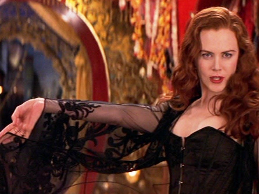 nicole kidman with arm outstretched in Moulin rouge
