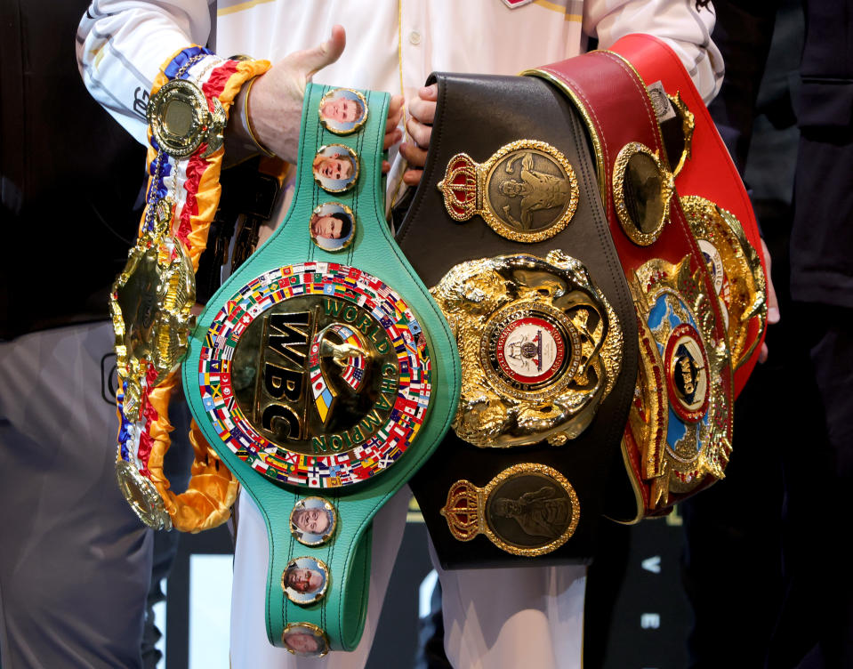 LAS VEGAS, NEVADA - MAY 05: Canelo Alvarez holds various belts as he poses during a news conference at the KA Theatre at MGM Grand Hotel & Casino on May 05, 2022 in Las Vegas, Nevada. Alvarez will challenge WBA light heavyweight champion Dmitry Bivol for his title at T-Mobile Arena in Las Vegas on May 7. (Photo by Ethan Miller/Getty Images)