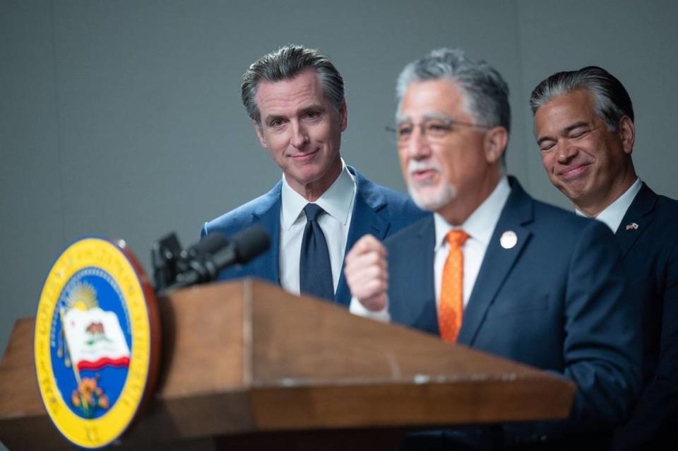 Gov. Gavin Newsom and Attorney General Rob Bonta listen to state Sen. Anthony Portantino, D-Burbank, on Tuesday as he talks about his bill that strengthens the state’s concealed carry regulations.