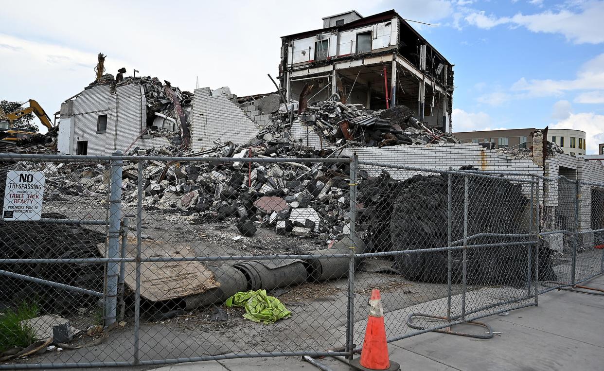 Demolition continues on the former Table Talk Pies building as seen from Madison and Washington streets.