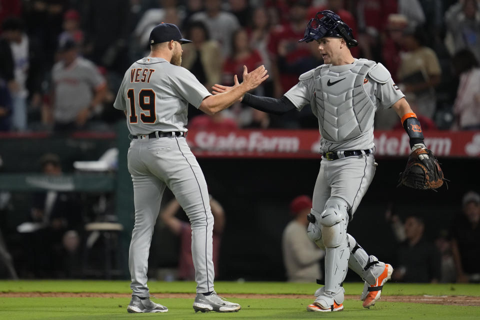 Detroit Tigers relief pitcher Will Vest (19) celebrates with catcher Carson Kelly (15) after winning 5-4 over the Los Angeles Angels in a baseball game in Anaheim, Calif., Saturday, Sept. 16, 2023. (AP Photo/Ashley Landis)