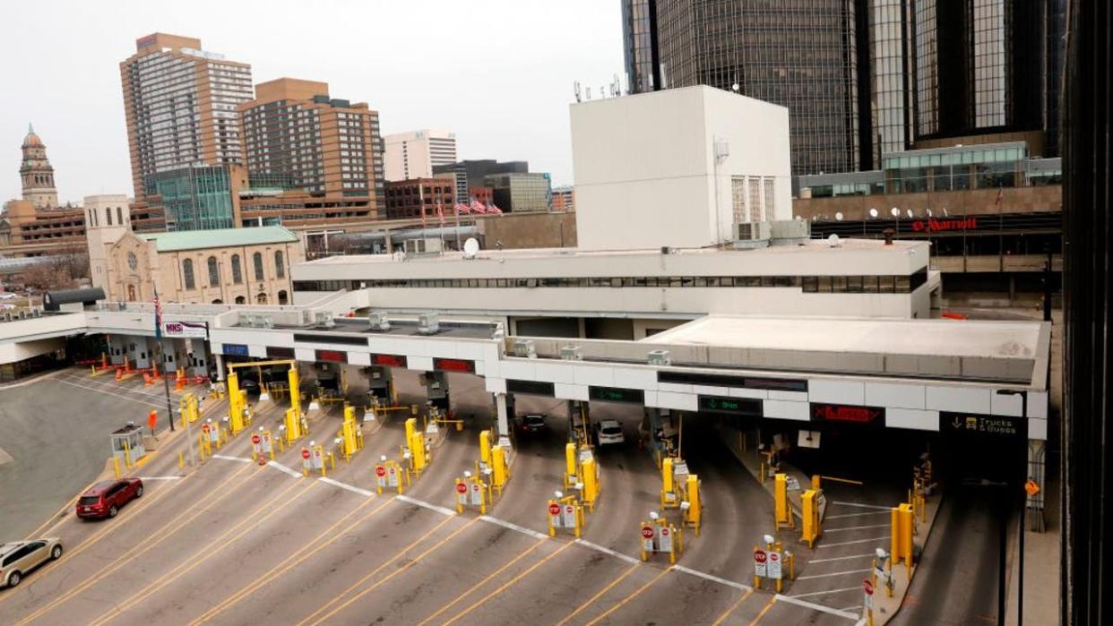 <div>A light flow of vehicles from Windsor, Canada, that traveled through the Detroit Windsor Tunnel enter the customs area in Detroit, Michigan on March 18, 2020. - US and Canada have mutually agreed on March 18, 2020 to temporarily restrict " non essential traffic" accross Canada-US border due to the coronavirus pandemic. (Photo by JEFF KOWALSKY / AFP) (Photo by JEFF KOWALSKY/AFP via Getty Images)</div>