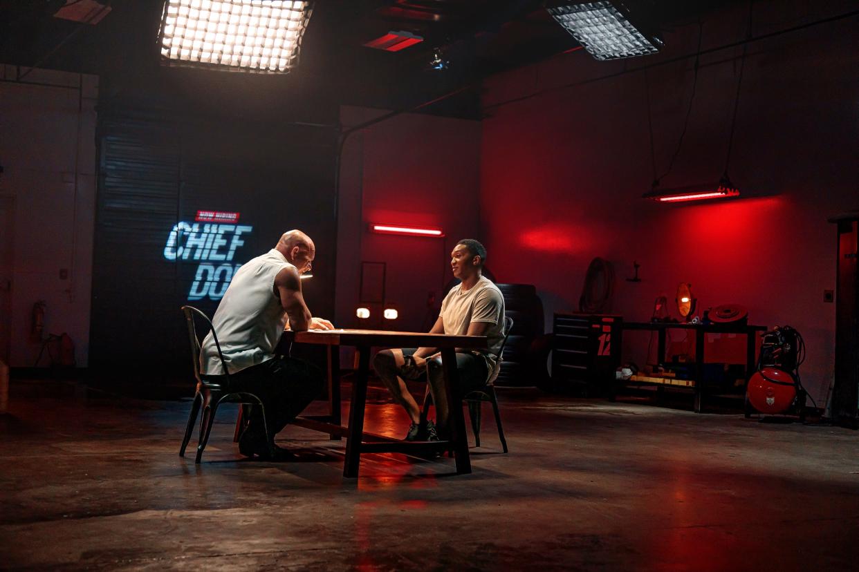 Wrestler Bill Goldberg interviews Preston Patterson before Patterson's selection as Dodge's "Chief Donut Maker."