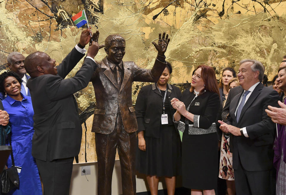 South Africa President Cyril Ramaphosa, left, United Nations General Assembly President Maria Fernanda Espinosa, center, and United Nations Secretary General Antonio Guterres attend the unveiling ceremony of the Nelson Mandela Statue which was presented as a gift from the Republic of South Africa, Monday, Sept. 24, 2018, at United Nations headquarters. (Angela Weiss/Pool Photo via AP)