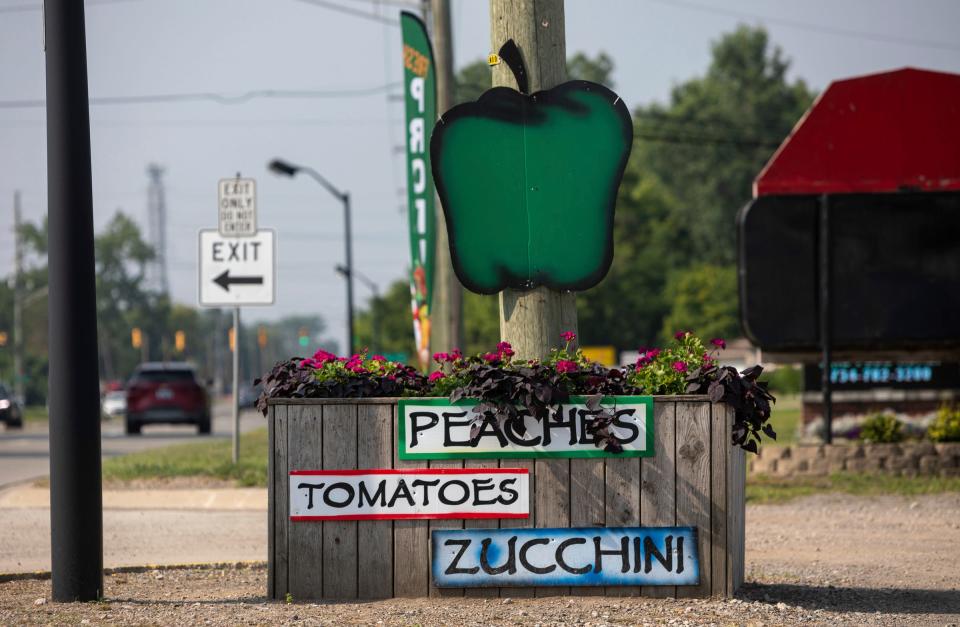 A zucchini sign sits outside the Farm Fresh Market at Ruhlig Farms & Gardens in Brownstown on Thursday, Aug. 3, 2023. 