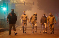 Police officers patrol after a protest against a new citizenship law in Delhi, India, December 20, 2019. REUTERS/Adnan Abidi