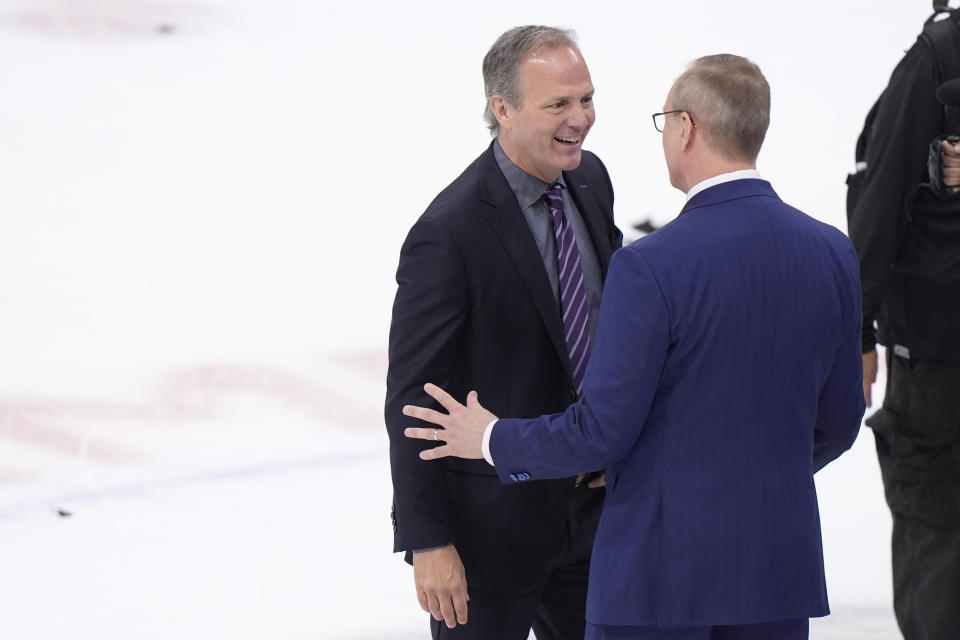 Tampa Bay Lightning head coach Jon Cooper, left, and Florida Panthers head coach Paul Maurice congratulate each other after the Panthers beat the Lightning 6-1 during Game 5 of the first-round of an NHL Stanley Cup Playoff series, Monday, April 29, 2024, in Sunrise, Fla. (AP Photo/Wilfredo Lee)