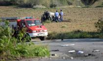 Police inspect the wreckage of a car bomb believed to have killed journalist and blogger Daphne Caruana Galizia close to her home in Bidnija, Malta on October 16, 2017