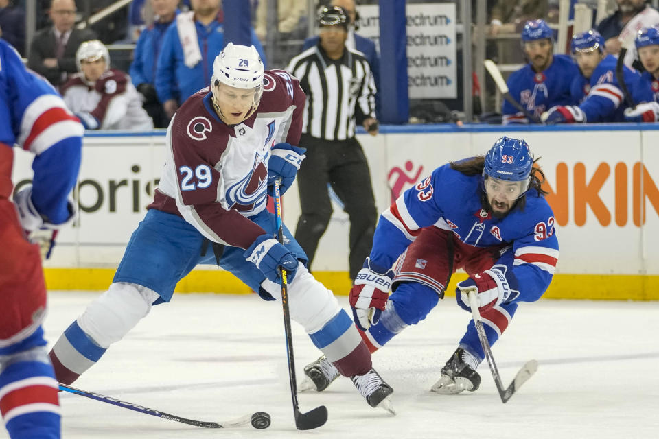 Colorado Avalanche center Nathan MacKinnon (29) skates against New York Rangers center Mika Zibanejad (93) during the first period of an NHL hockey game, Monday, Feb. 5, 2024, at Madison Square Garden in New York. (AP Photo/Mary Altaffer)