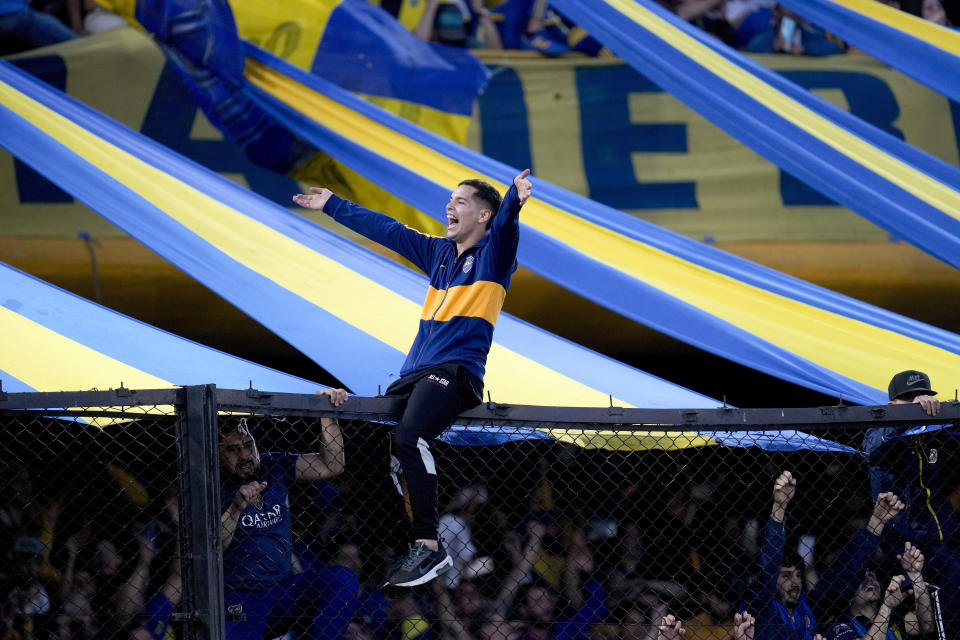 A Boca Juniors fan celebrates after his team became the local soccer tournament champion after a match against Independiente in Buenos Aires, Argentina, Sunday, Oct. 23, 2022. (AP (AP Photo/Natacha Pisarenko)