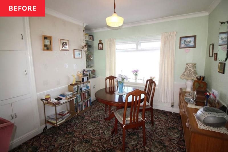 Floral carpets in dining room with green painted walls before renovation.