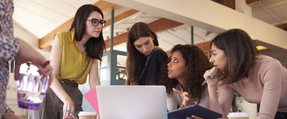 Female Designers Having Brainstorming Meeting In Office