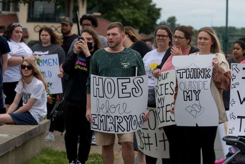 People listen to speakers at the Rally for Abortion Rights held at the Four Freedoms Monument in Evansville, Ind., Sunday afternoon, May 22, 2022.