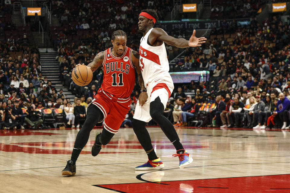 Chicago Bulls guard DeMar DeRozan (11) drives past Toronto Raptors forward Pascal Siakam (43) during the first quarter of an NBA preseason game in Toronto on Sunday, Oct. 9, 2022. (Alex Lupul/The Canadian Press via AP)