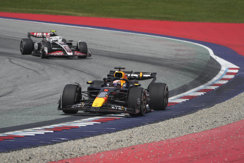 Red Bull driver Max Verstappen of the Netherlands, front, steers his car during the Austrian Formula One Grand Prix race at the Red Bull Ring racetrack in Spielberg, Austria, Sunday, June 30, 2024. (AP Photo/Darko Bandic)