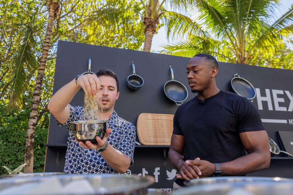 Nico Norena (@succulentbite) and Robert Lucas (@thesweetimpact) participate in a cooking demonstration at the 2023 FoodieCon at the South Beach Wine & Food Festival. World Red Eye