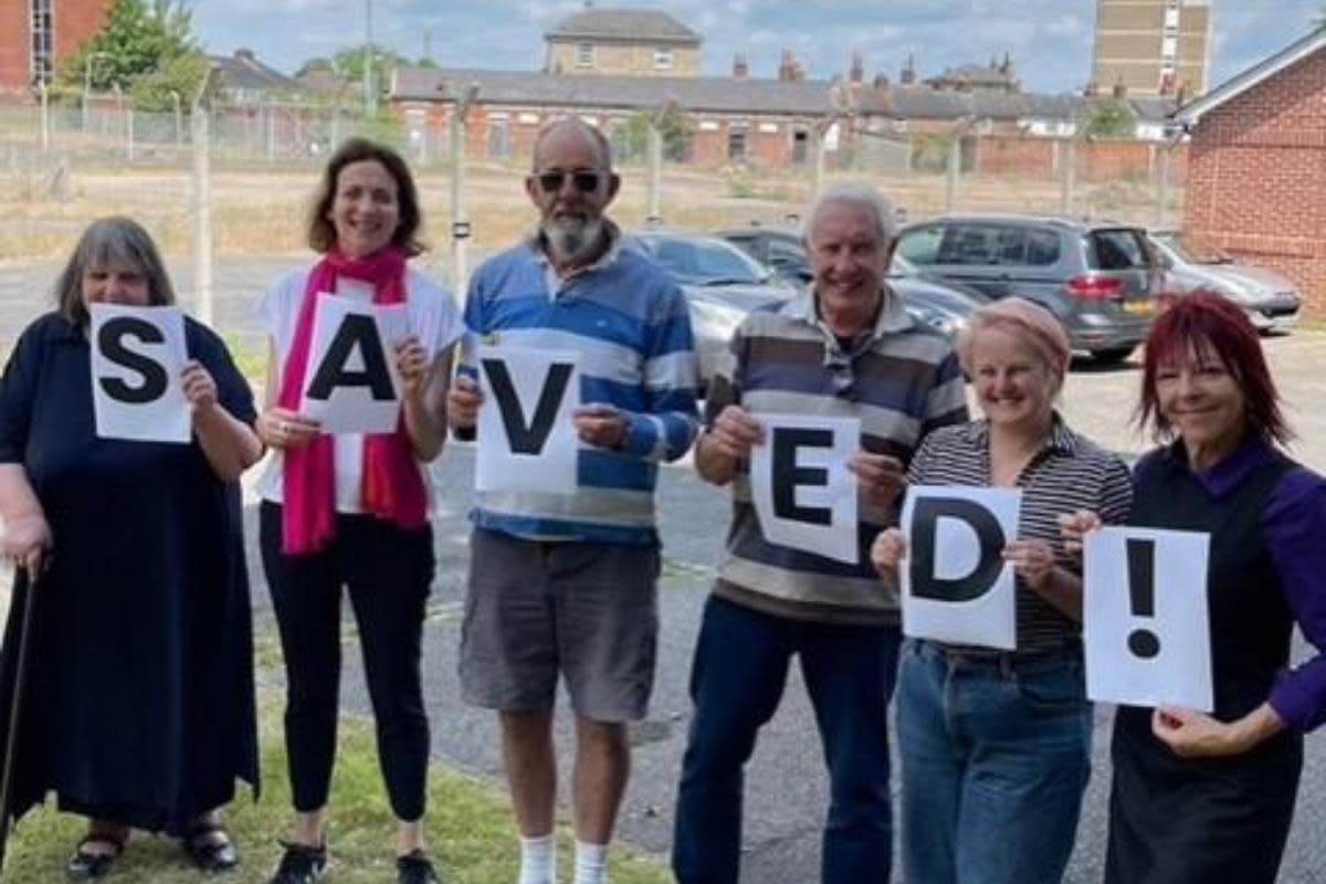 Saved - Campaigners stand in front of the 'War Horse Hospital' site after it was successfully listed Grade II <i>(Image: Pam Cox)</i>