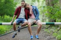 Gay married couple Dawid Mycek and Jakub Kwiecinski pose for a photograph in Hel