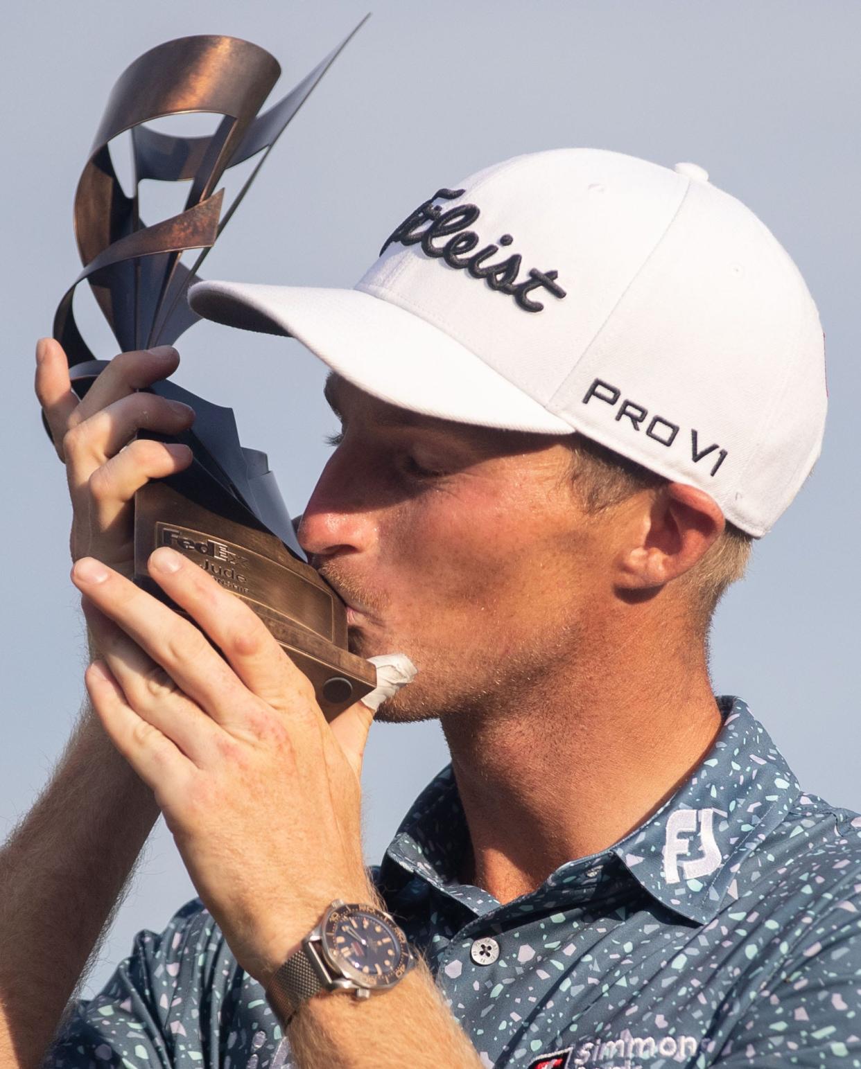 Will Zalatoris kisses his trophy after winning his first PGA tournament during the final round of the FedEx St. Jude Championship on Sunday, Aug. 14, 2022, at TPC Southwind in Memphis.