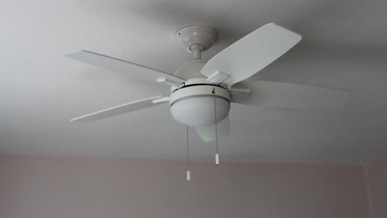 Your AC doesn't have to act alone – use a ceiling fan as well to keep cool and comfortable in the summer.