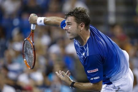 Stan Wawrinka of Switzerland serves to Kevin Anderson of South Africa during their quarterfinals match at the U.S. Open Championships tennis tournament in New York September 9, 2015. REUTERS/Eduardo Munoz