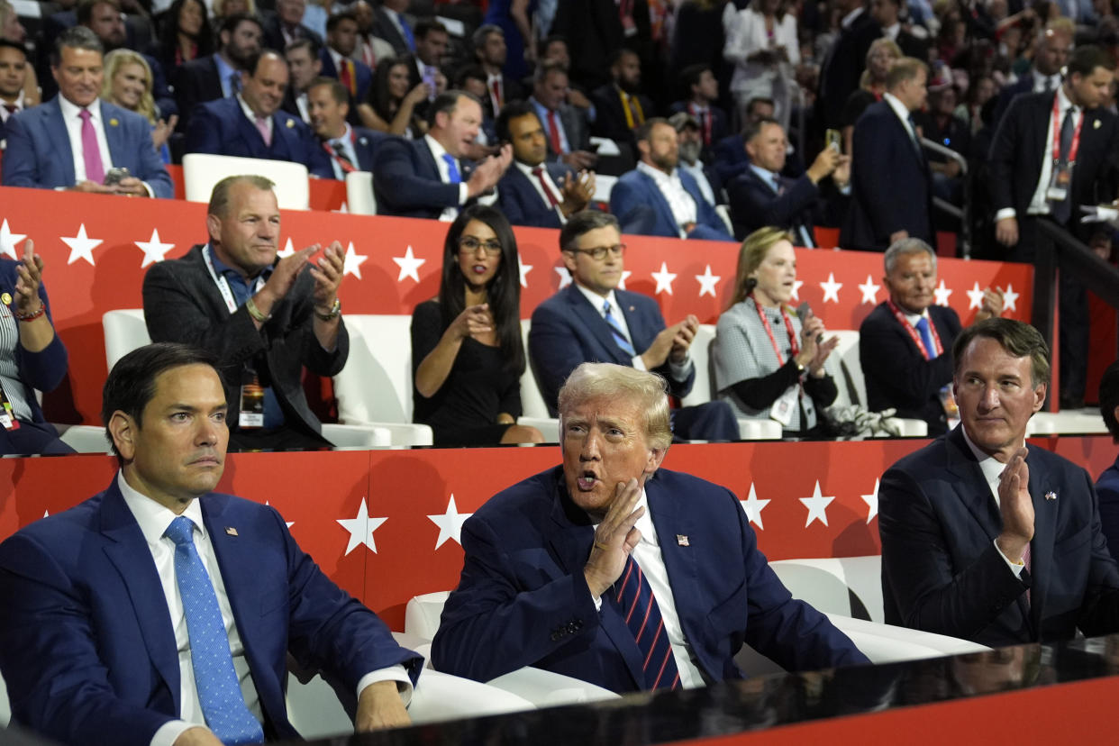 Republican presidential candidate former President Donald Trump talks as Sen. Marco Rubio, R-Fla., and Virginia Gov. Glenn Youngkin watch, during the third day of the Republican National Convention at the Fiserv Forum, Wednesday, July 17, 2024, in Milwaukee. (AP Photo/Evan Vucci)