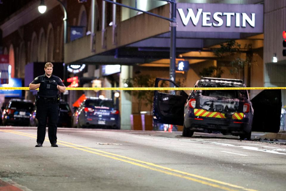 A police officer blocks a downtown street following a protest, Saturday, Jan. 21, 2023, in Atlanta, in the wake of the death of an environmental activist killed after authorities said the 26-year-old shot a state trooper.