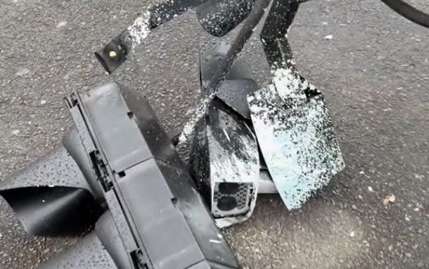 A traffic light and Ulez camera raised to the ground after having been sprayed white