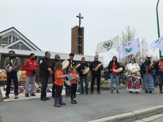 Participants in the Dene Nation memorial march made a stop in front of St. Patrick's Catholic church in Yellowknife.