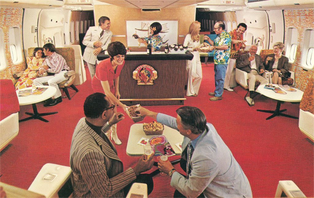 A waitress serving snacks in an airplane Party Lounge, 1960