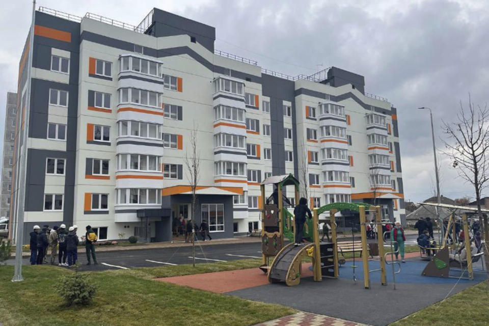 This 2022 photo shows one of the at least 14 apartment buildings Russians have constructed in the occupied Ukrainian city of Mariupol. Residents say there's a waitlist of more than 11,000 people for a new apartment. Most of the city's housing stock was hit by munitions during the siege of the city earlier in the year. (AP Photo)