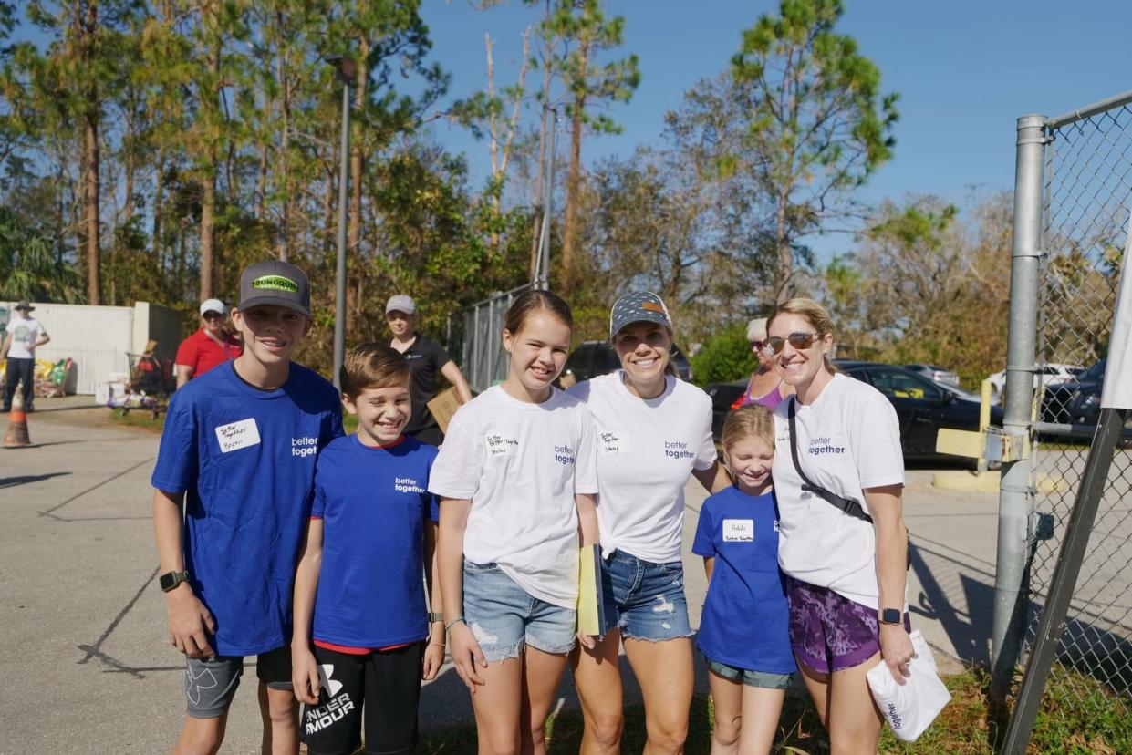 Better Together volunteers pose for a photograph during efforts to help with recovery after Hurricane Ian.