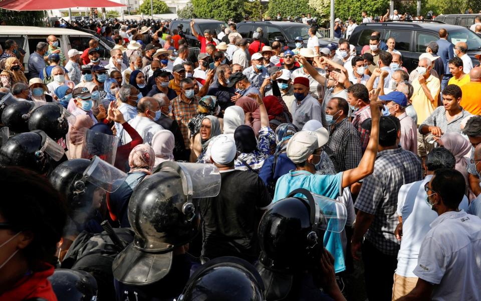 Tunisians gather after president ousts government, in Tunis - Zoubeir Souissi/Reuters