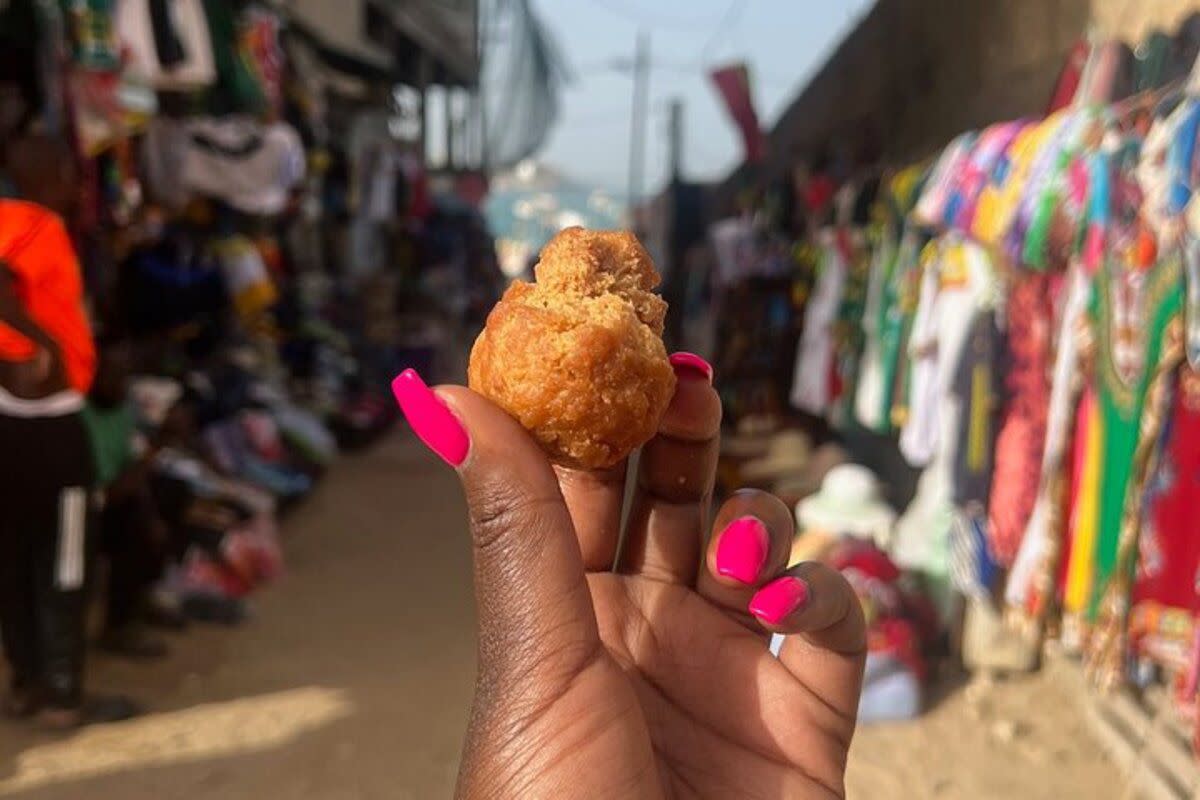 Female Hand Holding a Street Food Bite, Dakar, Senegal