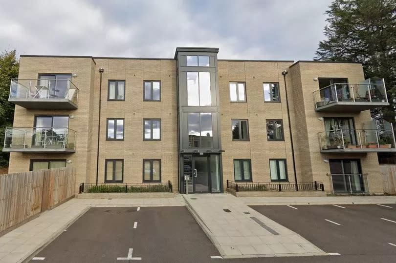 Three-storey block of flats, built in yellow brick.