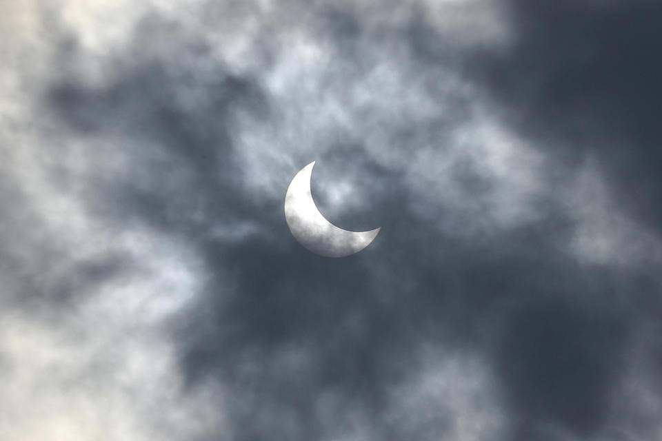A partial solar eclipse is seen from Jakarta, Indonesia Thursday, Dec. 26, 2019. (AP Photo/Tatan Syuflana)