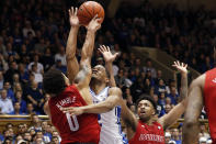 Duke guard Cassius Stanley drives to the basket while Louisville guards Lamarr Kimble (0) and David Johnson, right, defend during the second half of an NCAA college basketball game in Durham, N.C., Saturday, Jan. 18, 2020. Louisville won 79-73. (AP Photo/Gerry Broome)