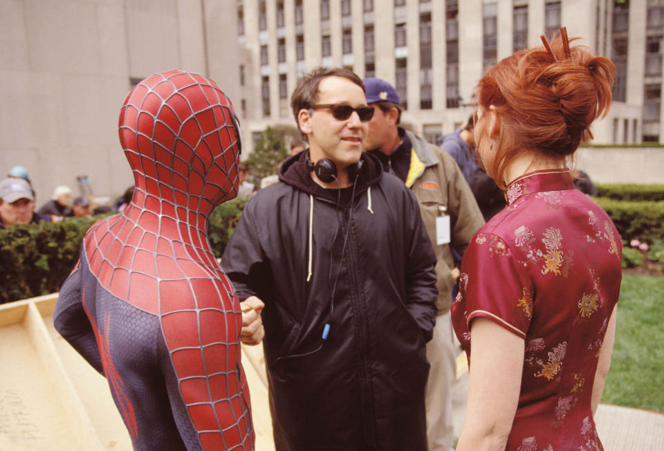 404731 04: (EDITORAL USE ONLY, COPYRIGHT COLUMBIA PICTURES) Director Sam Raimi (C), actors Tobey Maguire and Kirsten Dunst talk on the set of the movie "Spider-Man". (Photo by Columbia Pictures/Getty Images)