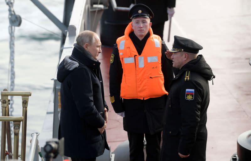 Russian President Vladimir Putin attends the joint drills of the Northern and Black sea fleets on board the Russian guided missile cruiser Marshal Ustinov in Sevastopol