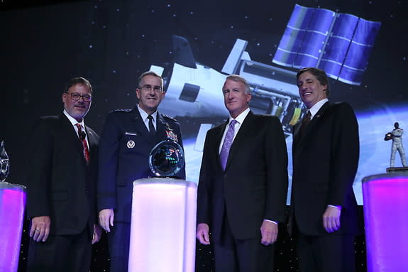 Left to right: Space Foundation Chief Executive Officer Elliot Pulham; Gen. John Hyten, Commander, Air Force Space Command, Peterson Air Force Base, Colorado; Craig Cooning, president of Network and Space Systems for The Boeing Company; and Lon